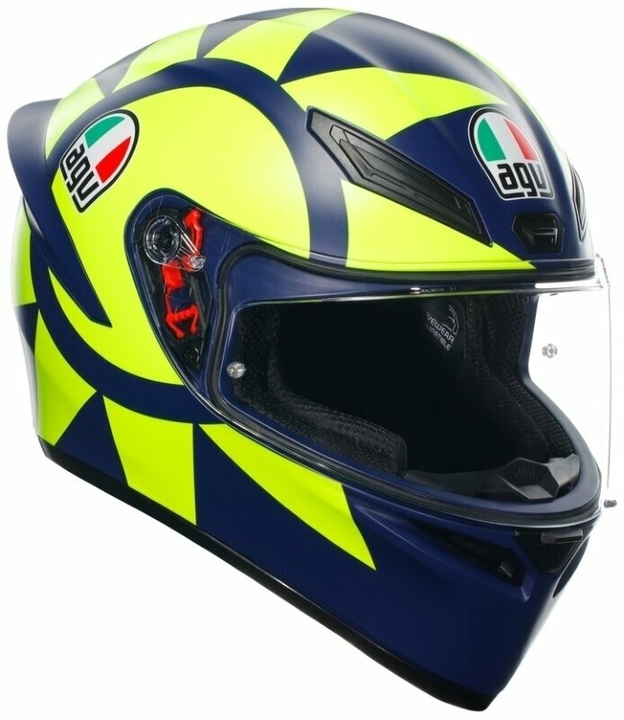 Full face helmet in matte dark blue and neon yellow with a star pattern, featuring AGV logos, a clear visor, and ventilation openings, size L.