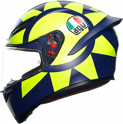 Full face helmet in matte dark blue and neon yellow, featuring a sunburst design, AGV logo, clear visor, and ventilation ports, size M.