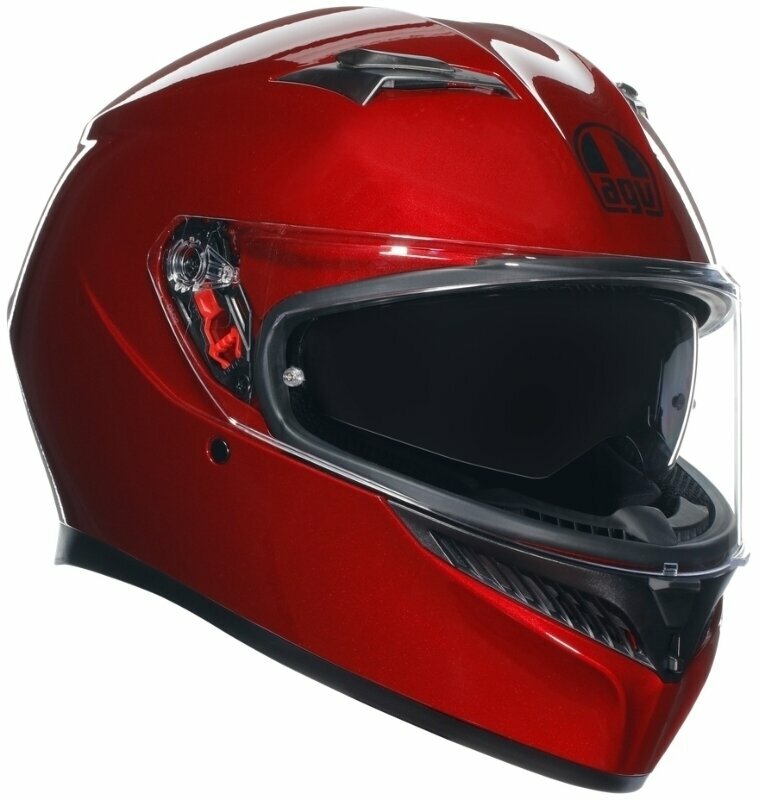 Red full face helmet with a glossy finish, featuring a black visor, aerodynamic design, and AGV logo on the front, designed for safety and style in motorcycle riding.