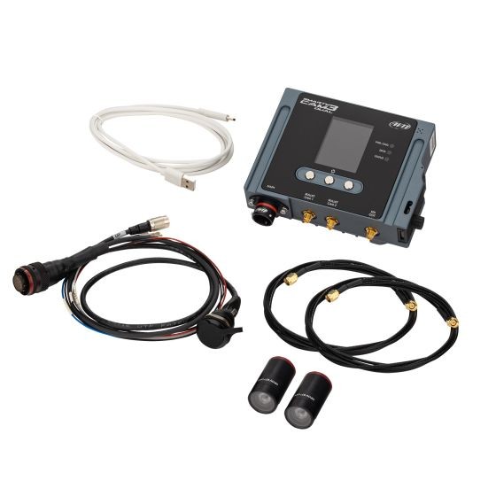 AiM Motorsport SmartyCam 3 Dual HD Camera System featuring a grey control unit, two black bullet cameras with 67-degree lenses, and various cables and connectors for installation.