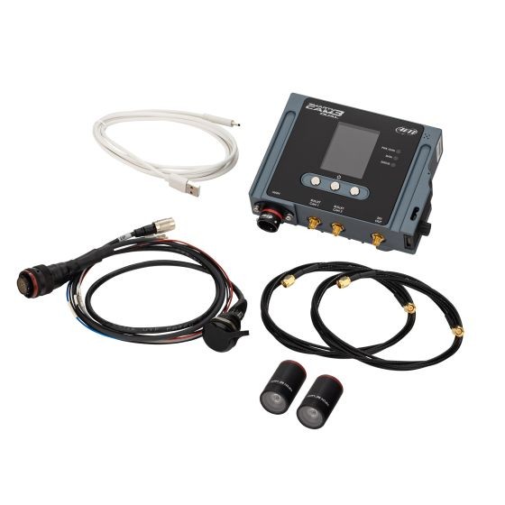 AiM Motorsport SmartyCam 3 system featuring a compact black camera unit with a display, two bullet cameras with 84-degree lenses, and various cables and harnesses for connectivity.