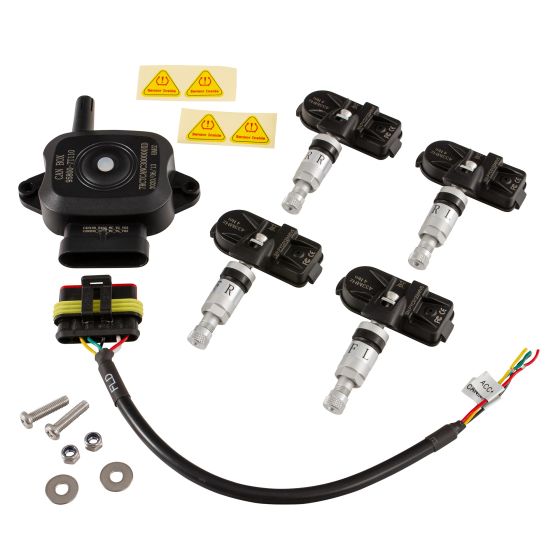 AIM Motorsport Tyre Pressure Monitoring System kit includes a black sensor unit, four silver sensors, wiring harness, screws, and warning labels for easy installation and monitoring.