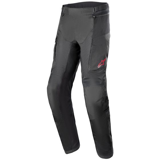 Black motorcycle trousers made from durable material, featuring mesh panels for ventilation, zippered pockets, and a red Alpinestars logo on the left thigh.