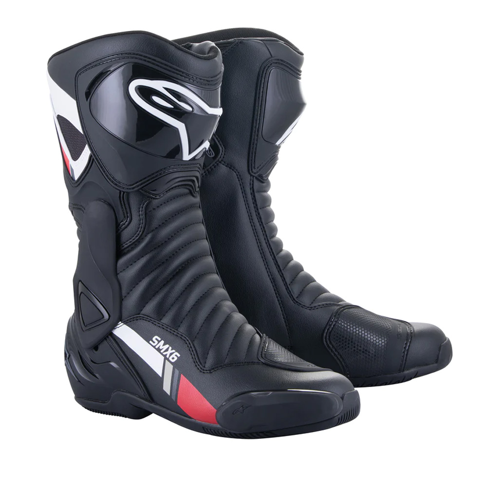 Black and white Alpinestars SMX-6 V2 motorcycle boots with grey accents, featuring a sleek design, protective materials, and a high-top silhouette for enhanced support.
