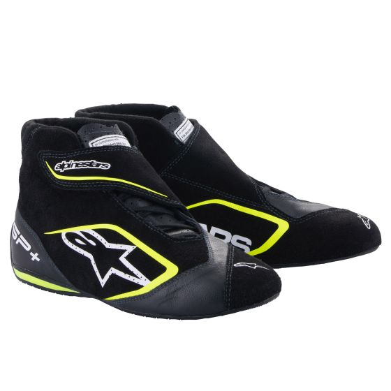Black racing boots with fluro yellow accents, featuring a sleek design, soft suede material, and a secure Velcro strap for enhanced fit and support, size UK 6.5 / EUR 40.