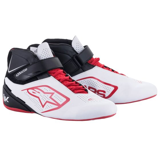 White, black, and red Alpinestars TECH-1 K V2 shoes featuring a sleek design, mesh panels for breathability, and a secure strap for a snug fit.
