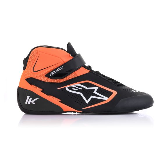 Black kart boots with fluro orange and white accents, featuring a high-top design, Velcro strap, and breathable mesh panels, size UK 7 / EUR 40.5 by Alpinestars.