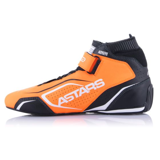 Fluorescent orange and black Alpinestars Tech 1-T V3 race boots with a sleek design, featuring a Velcro strap and perforated detailing for breathability.
