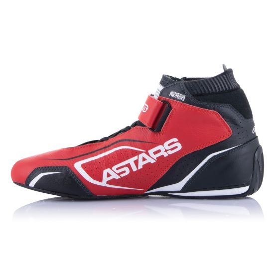 Red, black, and white Alpinestars Tech 1-T V3 race boots featuring a sleek design, ankle support, and a prominent "ASTARS" logo on the side.