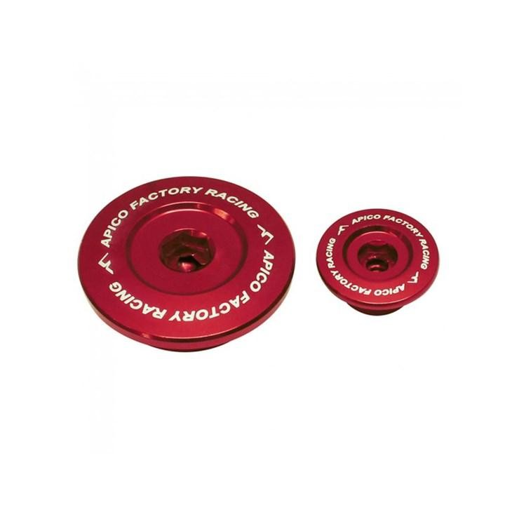 Red aluminum engine plugs by Apico for Suzuki RMZ250 (2007-22) and RMZ450 (2005-22), featuring a smooth finish and engraved branding.