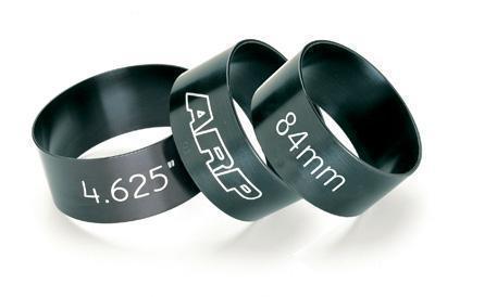 Three tapered ring compressors in black aluminum, featuring white markings for sizes: "4.625"" and "84mm," with the ARP logo prominently displayed on one.
