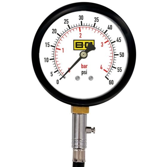 B-G Racing 4-inch tyre pressure gauge features a black casing, clear white dial with red markings, and a brass connector for accurate pressure readings in bar and psi.