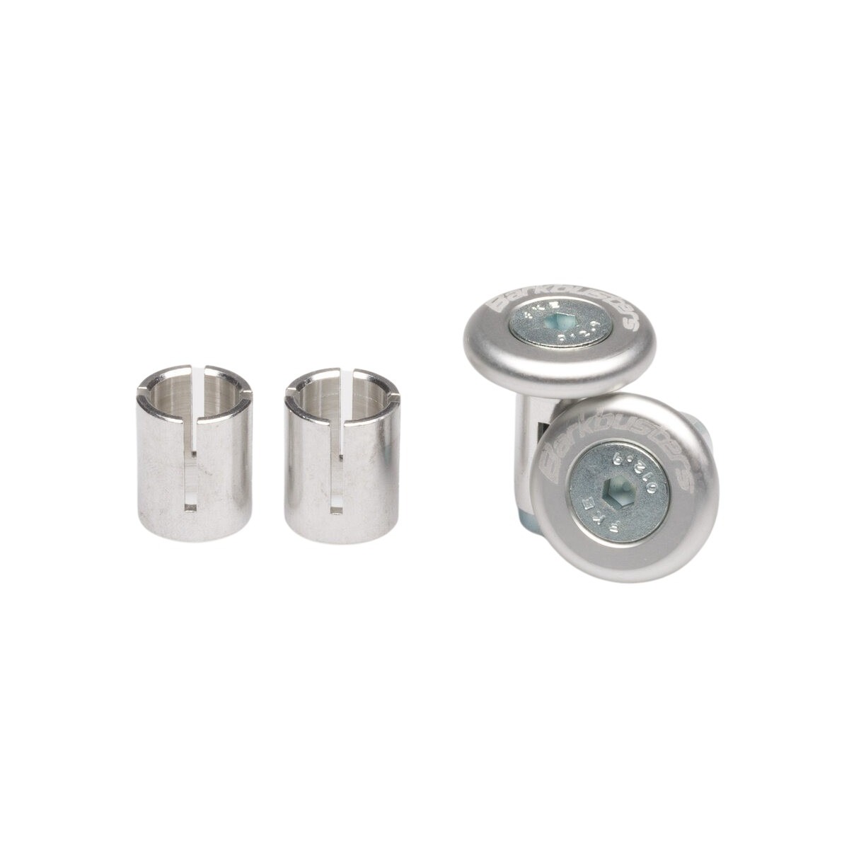 Anodized silver Barkbusters accessory bar end plug set, featuring two cylindrical plugs and two matching end caps, designed for motorcycle handlebars.