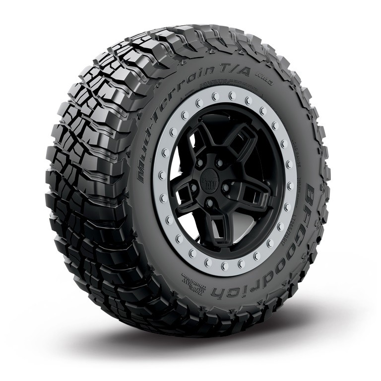 BFGoodrich Mud Terrain T/A KM3 tire features an aggressive tread pattern, black rubber material, and a rugged design, mounted on a black alloy wheel with silver accents.