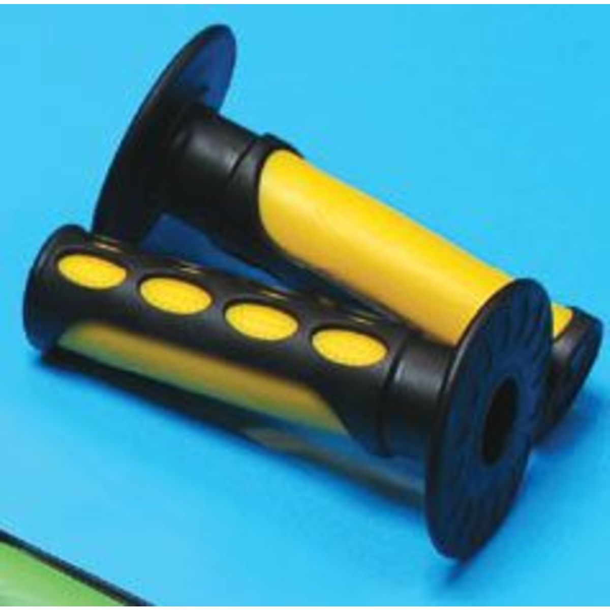 Two-tone motorcycle grips in yellow and black, featuring a textured surface for grip and ventilation holes along the yellow section, designed for comfort and control.