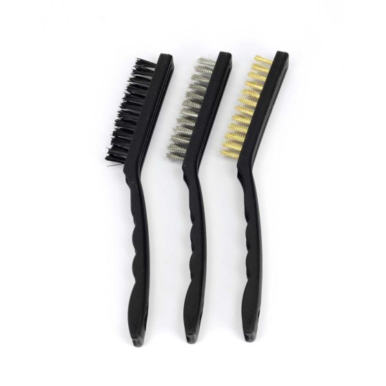 Three workshop brushes with black plastic handles: one with stiff black bristles, one with metal bristles, and one with brass bristles, designed for cleaning bike components.