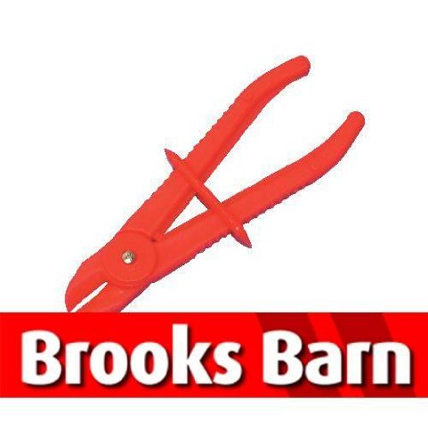 Bright red plastic fuel line clamp with a spring-loaded design and pointed tips, ideal for securely holding fuel lines in place.