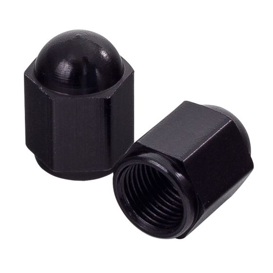 Black hexagon valve caps with a glossy finish, featuring a rounded top and internal threading for secure attachment to bike valves.