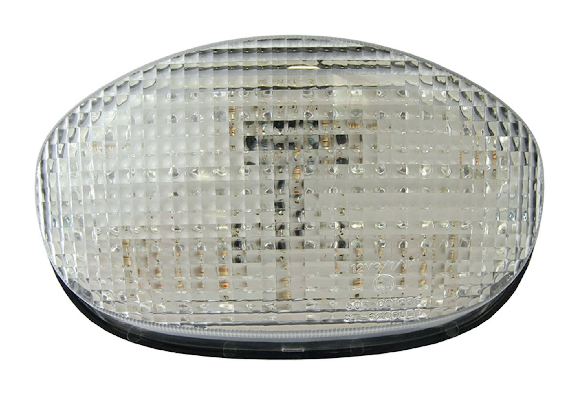 LED rear tail light with a clear lens, featuring integral indicators, designed for Triumph TT600 models from 2000 to 2003, showcasing a sleek, oval shape and textured surface.