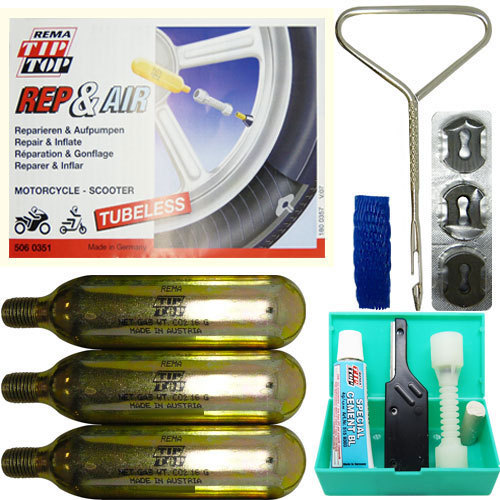 Motorcycle tubeless tyre repair kit featuring three yellow CO2 cartridges, a metal inflator, tire plugs, a reamer, and a blue storage box.