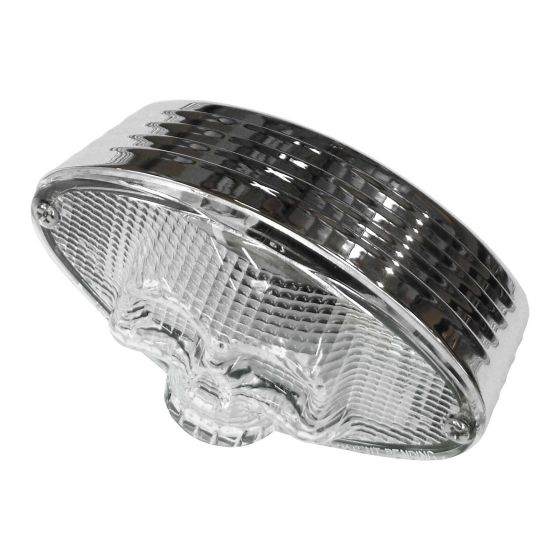 Clear 3D skull-shaped rear light with a glossy chrome finish, featuring horizontal grooves and a base for number plate illumination.