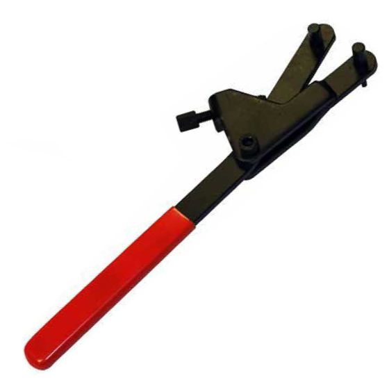 Black metal holder with a red plastic handle, featuring two adjustable pins for securing flywheel and clutch pulleys, designed for sizes 36-110 mm.