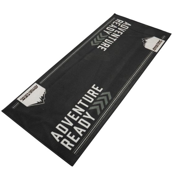 Black carpet with "ADVENTURE READY" text in bold white letters, featuring a mountain graphic and grey chevron designs, made from durable, eco-friendly material.