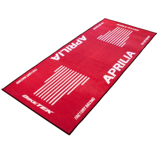 Red carpet featuring the Aprilia logo and white stripes, made of soft material, ideal for motorcycle enthusiasts and showcasing BikeTek branding.