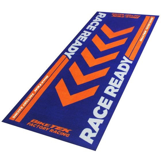 Blue carpet featuring bold orange chevron patterns and the text "RACE READY" and "BIKETEK FACTORY RACING," designed for cycling enthusiasts.
