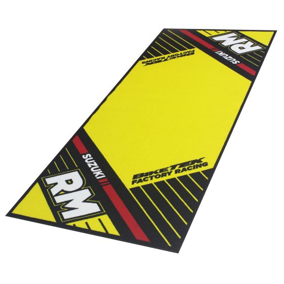 Bright yellow carpet featuring the Suzuki RM logo, with black accents and bold red stripes, designed for bike maintenance and showcasing the BikeTek brand.