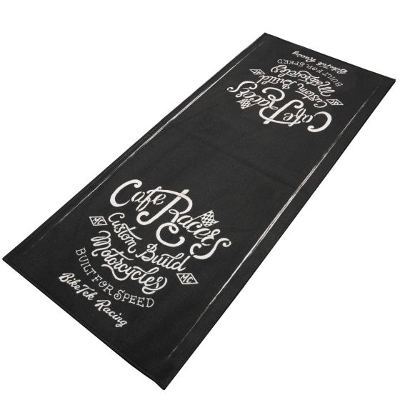 Black carpet with white text featuring the phrases "Cafe Racers," "Custom Build Motorcycles," and "Built for Speed," designed for bike enthusiasts and racing fans.