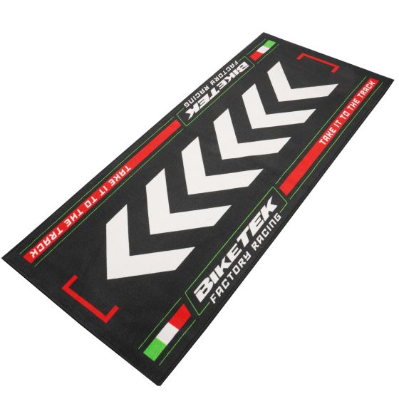 Black garage mat featuring white chevron graphics and red and green accents, measuring 190x80cm, with "BIKETEK FACTORY RACING" text and Italian flag design.
