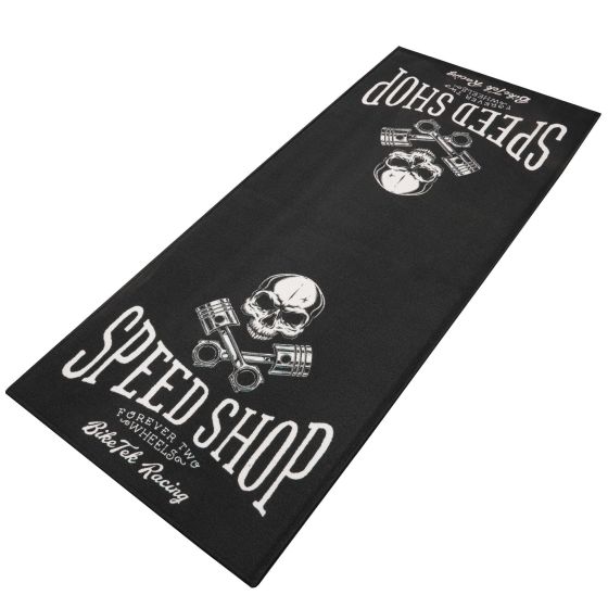 Black carpet featuring a skull and crossed pistons design, with the text "SPEED SHOP" prominently displayed in white, ideal for automotive enthusiasts.