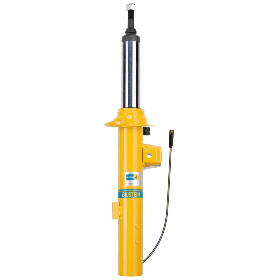 Yellow gas pressure shock absorber with a twin-tube design, featuring a polished metal shaft, a black adjustment knob, and a label indicating "BILSTEIN" and "DampTronic®."