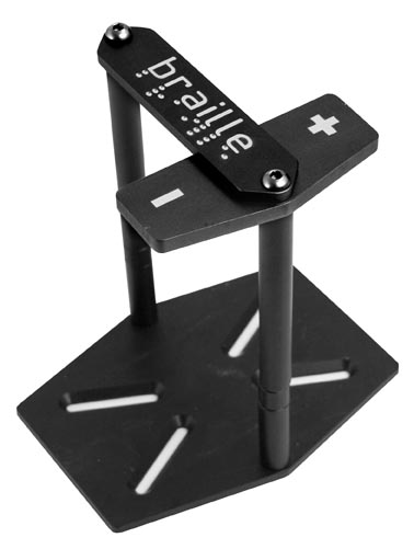 Black aluminum battery mount kit with a hexagonal base, featuring two vertical supports and a top plate labeled with "+" and "-" symbols, designed for secure battery installation.