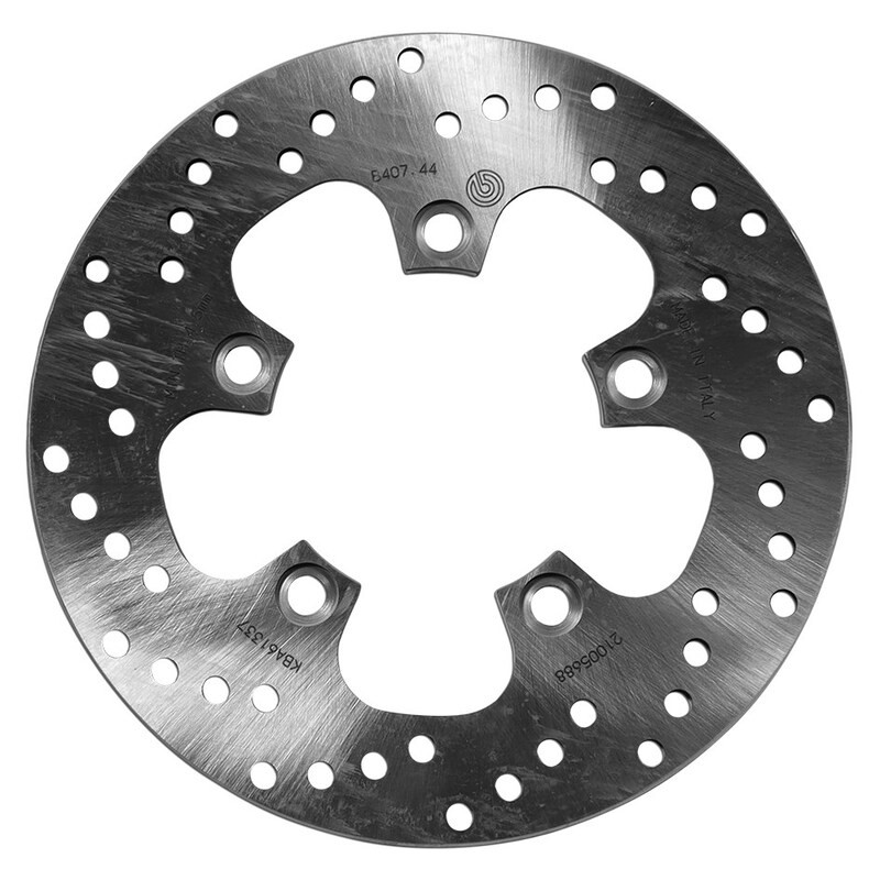 Round fixed brake disc by Brembo, featuring a shiny metallic surface with multiple drilled holes and a distinctive star-shaped design for enhanced braking performance.