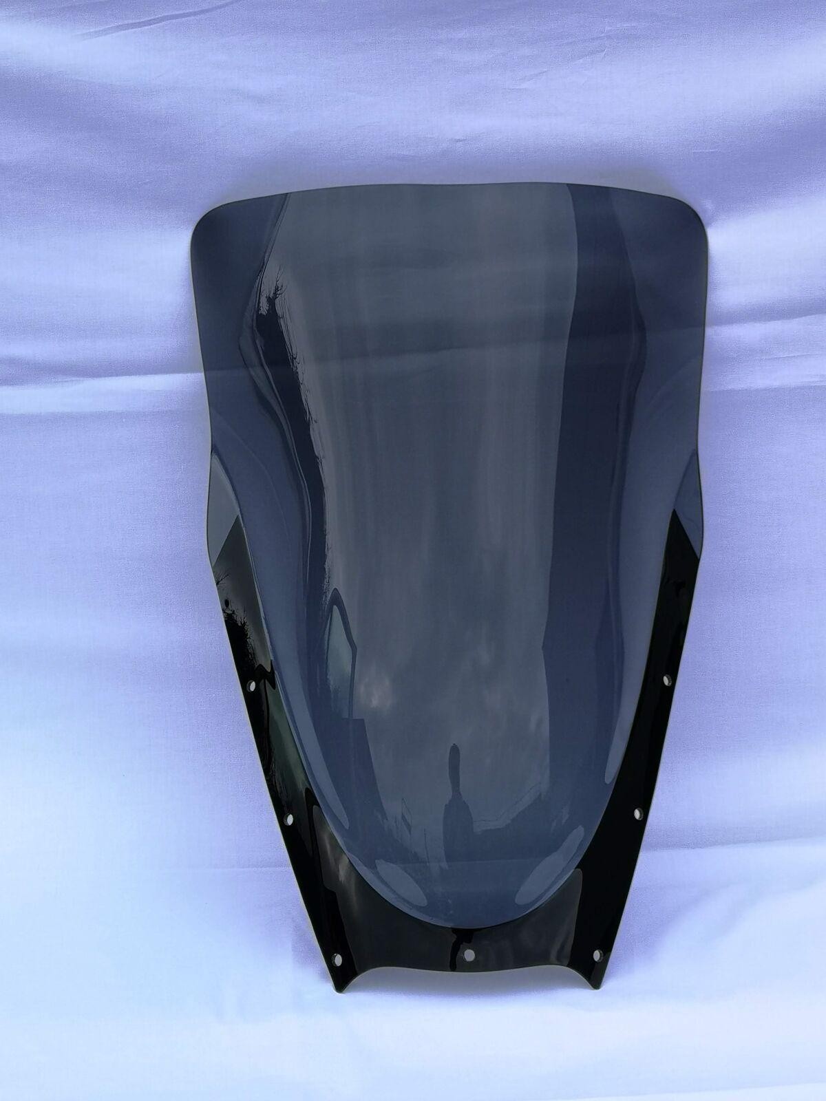 Grey smoke windshield for Yamaha TDM 900 (2002-2006), measuring 54 cm (21-1/4"), featuring a sleek design with a glossy black edge and multiple mounting holes.