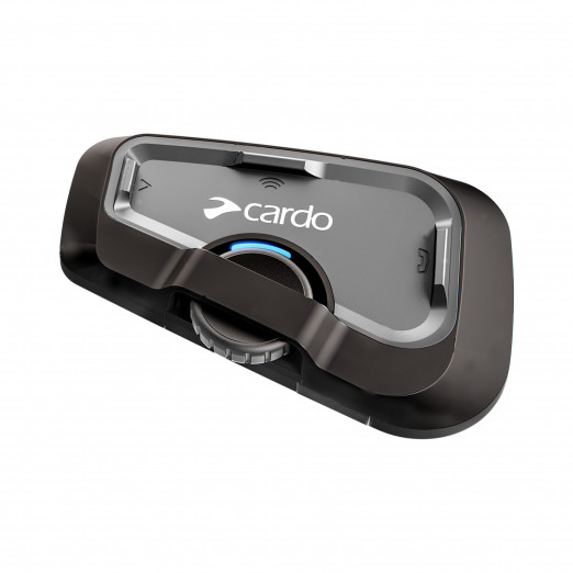 Black Cardo Freecom 4x communication system featuring a sleek design, central control knob, and wireless connectivity indicator, ideal for motorcycle riders.