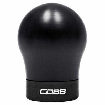 Black aluminum shift knob with a rounded top and a matte finish, featuring a white "COBB" logo on the base, designed for Fiesta ST, Focus ST, and Focus RS models.