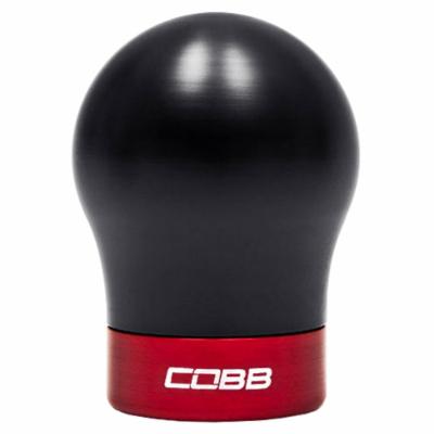 Black shift knob with a rounded top and a red base, featuring the "COBB" logo in white, designed for Fiesta ST, Focus ST, and Focus RS models.