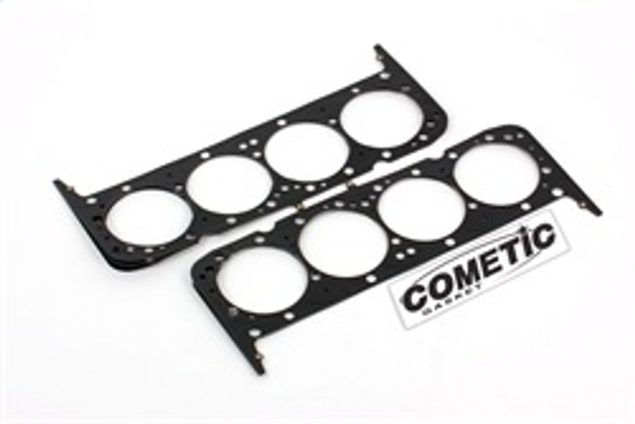 Multi-layer steel cylinder head gasket for Nissan, featuring a black finish, multiple round cutouts for cylinders, and Cometic branding in the corner.