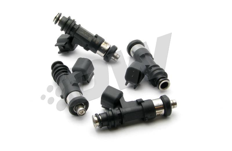 Four black fuel injectors with metal tips and electrical connectors, designed for DeatschWerks 750cc applications in WRX, Legacy GT, and STI vehicles.