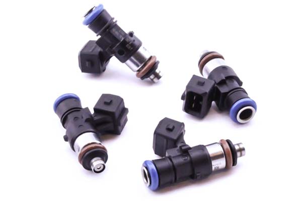 Four DeatschWerks 1500cc fuel injectors with black plastic bodies, blue O-rings, and metal tips, featuring a universal 40mm length for enhanced performance.