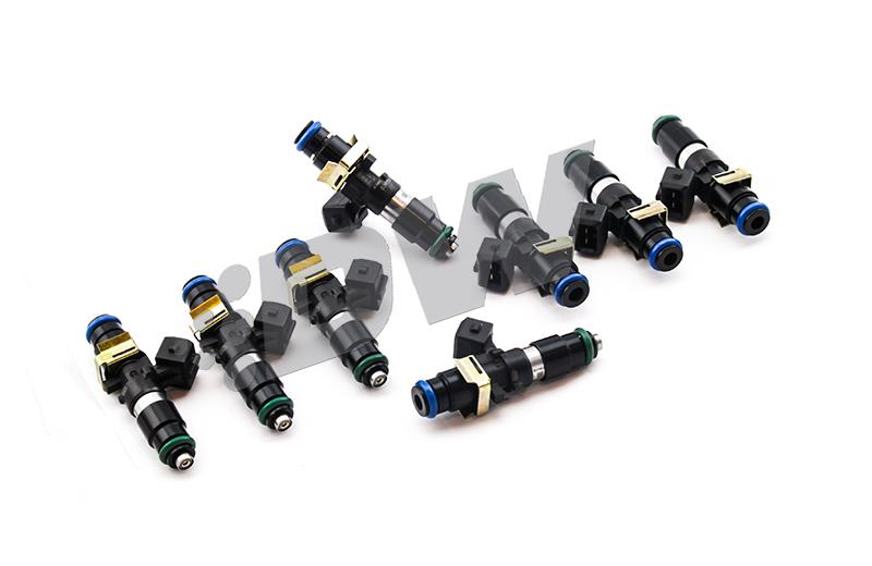 Eight DeatschWerks 1200Cc Bosch Ev14 fuel injectors, featuring black and green plastic bodies, gold connectors, and blue O-rings, arranged on a white background.