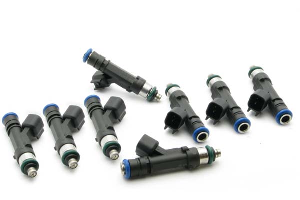 Eight black fuel injectors with blue and green accents, featuring a cylindrical body and electrical connectors, designed for F-Series and Shelby GT350 vehicles.