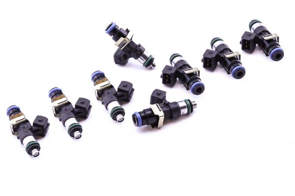 Black and green fuel injectors with blue accents, featuring a metal connector and multiple o-rings, designed for BMW and Mercedes-Benz vehicles.