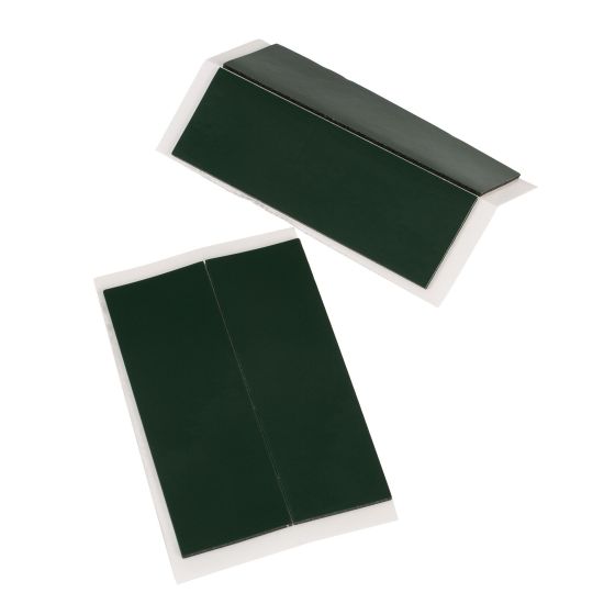 Self-adhesive dark green pads designed for fixing license plates and trim, featuring a smooth surface and a peel-off backing for easy application.