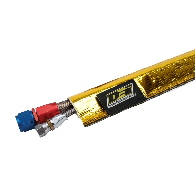 Gold universal exhaust heat sheath, measuring 0.75 in. x 36 in., featuring a reflective surface and a connector with blue and red fittings at one end.