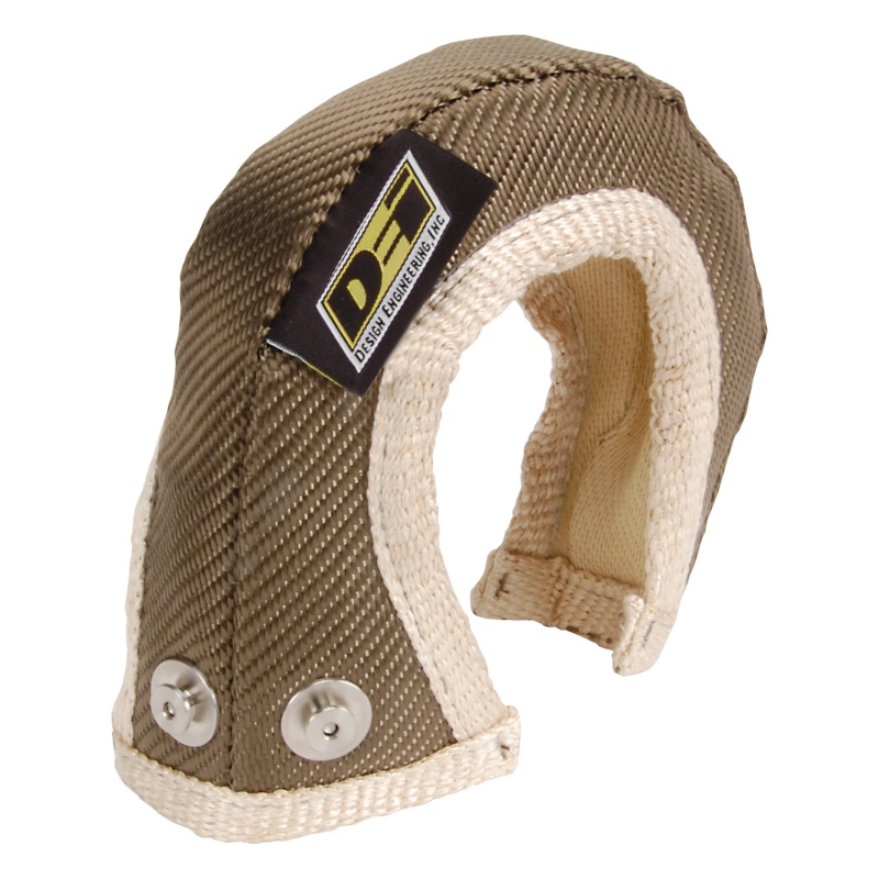 Titanium turbo shield in a brown and beige color scheme, featuring a textured exterior, reinforced stitching, and a logo patch with two metal snaps for secure attachment.