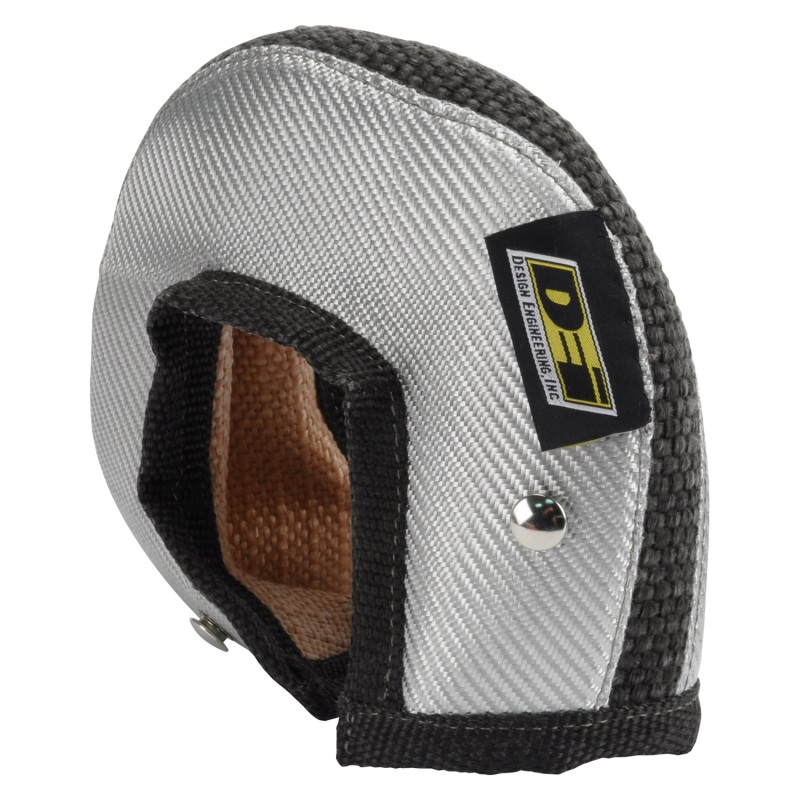Silver and black heat shield designed for T4 turbo, featuring a textured exterior, reinforced edges, and a logo patch, made from durable materials to protect against heat.